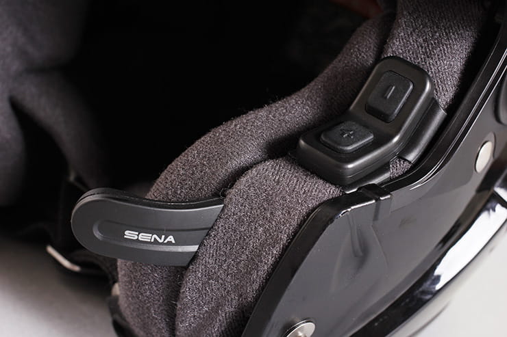 Sena 10U motorcycle intercom mounted in a helmet